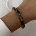 Detailed view of a dark green retro enamel bangle with gold floral patterns - 6CM Diameter / Dark Green Gold Small Floral (BR26Y0272-2)