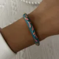 Close-up detail of a vintage teal enamel bangle with pink floral patterns and gold trim - 6CM Diameter / Deep Cyan Pink Petal (2#BR26Y0270-5)