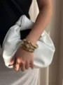 Vintage gold modular watch and stacked evil eye charm bracelet set on model wrist - Gold Jewelry Collection (A854)