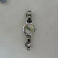 Elegant silver-tone evil eye watch featuring a modular link charm bracelet steel strap - A855 Silver Single Watch