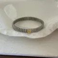 Elegant expandable silver steel band bracelet featuring a gold square diamond-set charm - Stretch Bracelet (Square Block) / Silver/Gold
