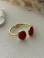 Detailed view of gold alloy bangle with two large oval red stones - Open Oval Red Turquoise Style (A656)