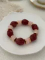 Elegant vintage candy-colored glass beaded elastic bracelet in red and pink colors. - Red And Pink