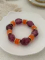 Vintage style candy colored glass bead elastic bracelet with purple and orange accents - Purple And Orange