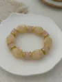 Vintage candy color glass elastic bracelet with cream and pink beads and gold accents - Beige And Light Pink