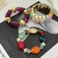 Prachtige macaron gekleurde kralen armband set met gouden brede bangle voor dames - Paarse Sieradenset