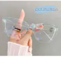 Detail view of oversized cat-eye glasses featuring a stylish transparent blue frame - Transparent Blue