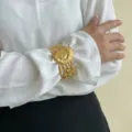 Elegante bracciale rigido dorato a foglia irregolare in acciaio inossidabile sulla manica - Stile Nautilo (0122)