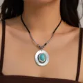 Detail of vintage turquoise hat pendant necklace with black velvet cord on model - Necklace (606498) / Antique Silver