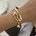 Elegant gold-tone minimalist wavy cuff bracelet with modern organic design for women - Geometric S-Shape Streamline Style (A761) / Gold