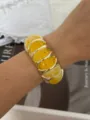 Trendy yellow marbled resin elastic bracelet with polished gold-tone metal spacers - Lemon Yellow