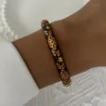 Vintage Chinese style enamel bangle with delicate orange floral pattern on black base - 6CM Diameter / Black Orange Gold Petal (BR26Y0276-3)