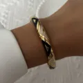 Vintage gold bangle with black and white enamel geometric patterns shown on wrist - 6CM Diameter / Black and White Geometric Style (BR26Y0273-2)