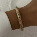 Elegant vintage enamel bangle bracelet featuring delicate green floral patterns on a beige base - 6CM Diameter / Beige Green Floral (BR26Y0275-3)