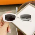 Stylish children's sunglasses featuring white egg-shaped frames and gradient lenses - White Frame Gray Lens