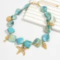 Collana in stile oceanico con pezzi di conchiglia blu e ciondoli a forma di stella. - Collana (1056675) / Blu