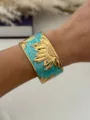 Vintage gold-plated stainless steel cuff bracelet with sunflower and teal enamel - Blue Gold Patterned Style