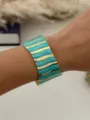 Vintage gold stainless steel open cuff bracelet featuring vibrant turquoise enamel stripes - Blue Gold Vertical Stripe Style