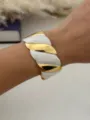 Elegante bracciale rigido a sirena in acciaio inossidabile con fasce dorate e smalto bianco - Spirale Bianco Oro