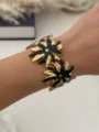 Eleganter vergoldeter Edelstahl-Armreif mit schwarzen Seestern-Blumenmustern für Damen - Schwarz Gold Sonnenblume