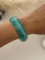 Bohemian style turquoise enamel open bangle bracelet with gold-tone finish on wrist - Green Gold (3557) / Cyan Blue