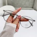 Modern transparent tea-colored anti-blue light glasses for women with round frames - Transparent Grey
