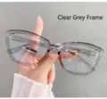 Stylish transparent gray cat-eye glasses featuring anti-blue light and UV400 lenses. - Transparent Grey