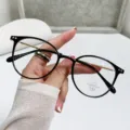 Classic black round frame anti-blue light glasses with elegant gold temples for women - Glossy Black Frame / Photochromic Lenses