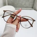 Lightweight tea-colored round glasses with anti-blue light lenses for women - Transparent Tea / Photochromic Lenses