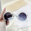 Lindas gafas de sol con forma de concha para niños, montura transparente y filtro UV. - Montura Azul Transparente Lente Azul
