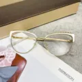 Stylish cat-eye anti-blue light glasses with gold metal frame and white accents - White Gold / Photochromic Lenses