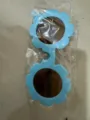 Blue flower-shaped children's sunglasses in transparent plastic packaging for kids - Sky Blue