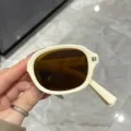 Occhiali da sole pieghevoli rétro bianco avorio con lenti marroni, protezione UV - Montatura Bianco Crema Pieghevole Lenti Tè