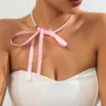 Vintage pearl necklace featuring a large pink ribbon bow for a truly elegant look - Single Layer Style (875619) / Pink