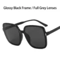 Oversized square sunglasses featuring bright black frame and solid gray lenses for women - Black Frame Grey Lens