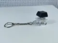 Close-up detail of the mechanical keyboard switch decompression keychain with a black keycap. - No Light / [1-Button Thick Cover Snake Chain] Black