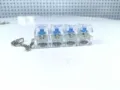 Vista detallada del llavero de 4 interruptores mecánicos transparentes con ejes azules - 4 Teclas Lineal - Sin Luz / Transparente