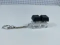 Detail view of a double mechanical switch fidget keychain with black keycaps and clear base - No Light / [Two-Key Thick Cover Snake Chain] Black