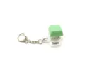 Close-up of a luminous mechanical keycap fidget keychain featuring a green cap. - [with light] light green