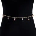 Close-up of golden body chain with starfish and shell charms on black mannequin - Gold Starfish Shell Pearl Style (NC24Y0825-3)