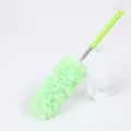 Green telescopic microfiber duster for home cleaning, bendable dusting tool with handle. - Green and White