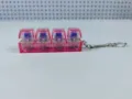 Detail van roze transparante lichtgevende mechanische schakelaar tester sleutelhanger - 4-Key Style / Geen Licht / Roze