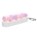 Detail view of pink mechanical keyboard keycap keychain with glowing LED lights - Model One / 4 Keys Without Light