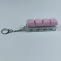 Detail shot of a 4-key mechanical keyboard switch fidget toy keychain with pink keycaps. - Four-Key Thick Cover Ordinary Chain / No Light / Pink