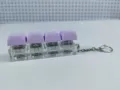 Detailed view of the 4-key mechanical keyboard switch keychain with pastel purple keycaps. - Four-Key Thick Cover Ordinary Chain / No Light / Purple