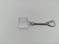 Detailed view of a transparent mechanical keyboard switch tester base keychain frame - Single Key Base With Snake Chain / High Transparency