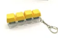 Mechanical keyboard switch fidget toy keychain with four yellow keycaps and metal ring. - 4-Key Luminous / Yellow