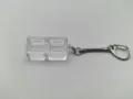 Close-up of clear mechanical keyboard switch tester keychain base with two slots - Double Key Base With Snake Chain / High Transparency