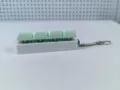 Detailed side view of a 4-key mechanical switch tester keychain for stress relief - Style 16 / 4 Keys Without Light