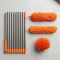 Extendable duster set with stainless steel pole and 3 replaceable cleaning brush heads. - Orange